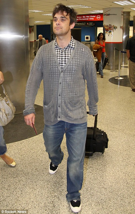 Robbie Williams si-a schimbat look-ul!