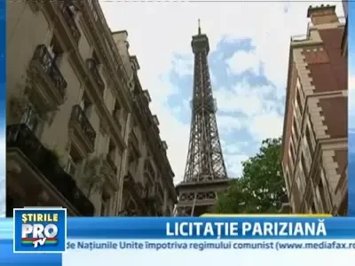 O bucata din casa scarilor de la Turnul Eiffel, vanduta cu 85.000 de euro