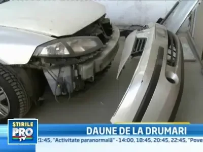 Soferi de Romania! Cu masinile in service dupa ce au dat cu ele in gropi!