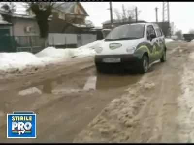 Bucurestiul se scufunda in noroi si gropi