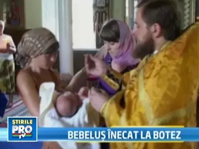 Bebelus mort in timpul botezului. Parintii acuza preotul de neglijenta