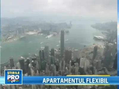 32 de metri patrati = 2 dormitoare, o sala de cinema, o bucatarie, un birou