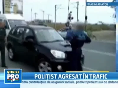 Un politist a fost luat pe capota de o soferia teribilista!