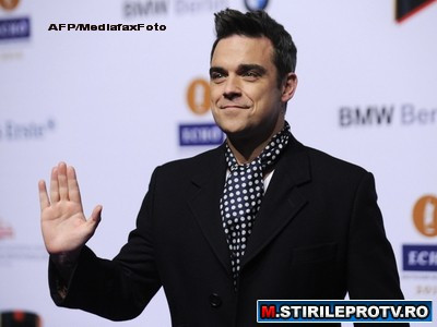 Aroganta sau prostie? Unul dintre cei mai bogati artisti din lume, Robbie Williams, vrea in comunism