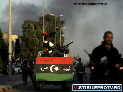 Unul dintre fiii lui Ghaddafi vrea sa negocieze incetarea focului. "In curand va fi o baie de sange"