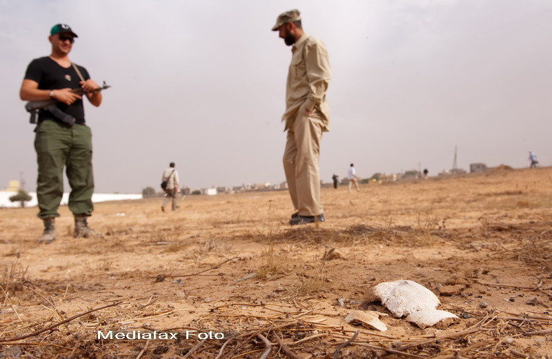 Ramasitele a peste 1.700 de detinuti, descoperite la Tripoli. Peste corpuri fusese turnat acid
