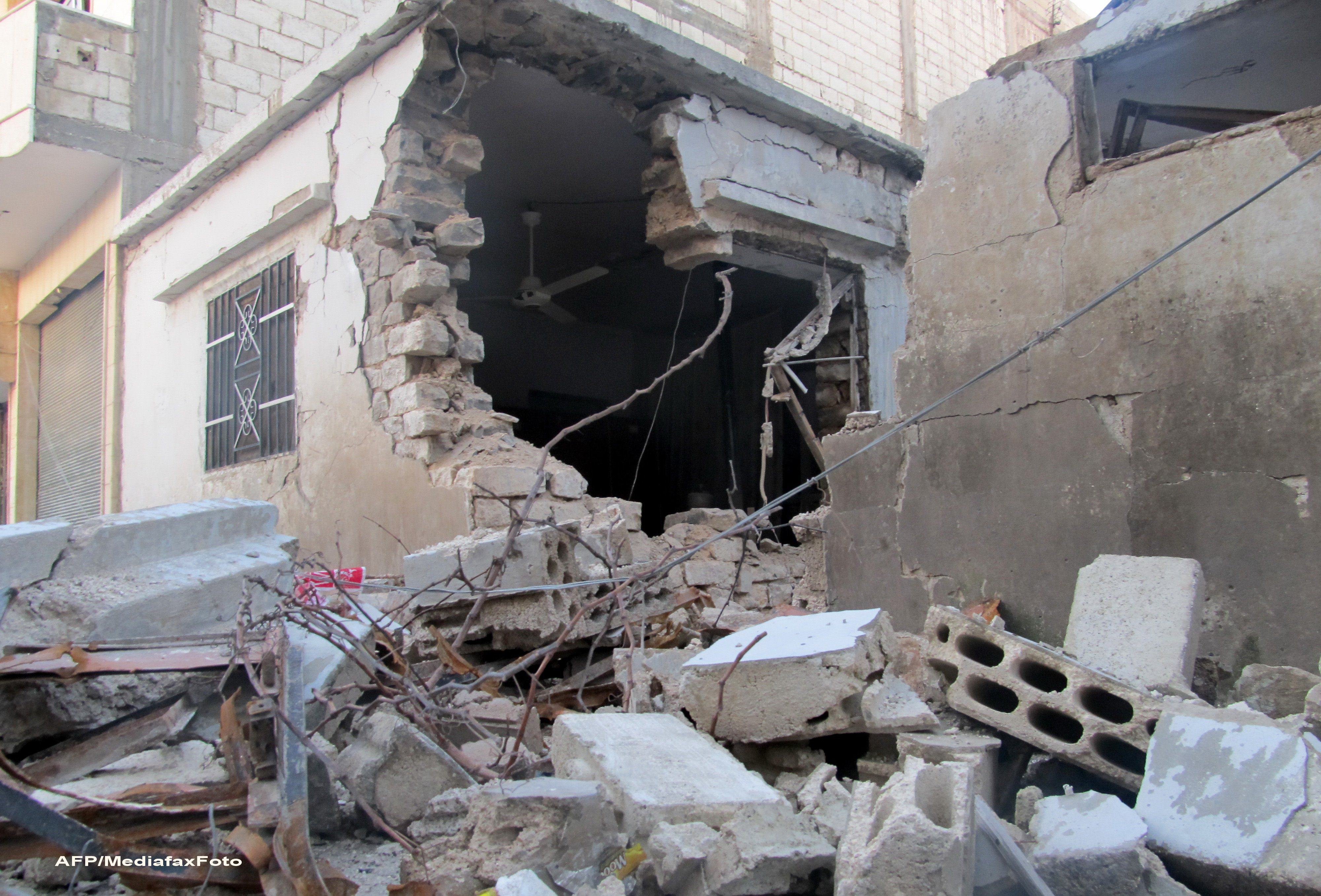 Cadavrele a cel putin 65 de persoane executate cu cate un glont in cap, descoperite in Siria