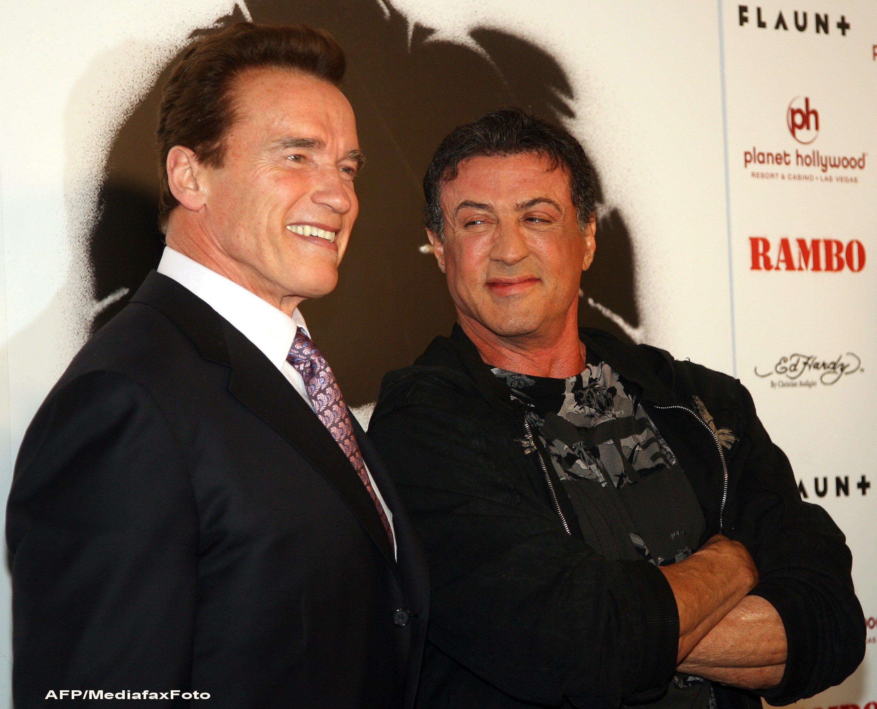 Se "iubeau" de 20 de ani, dar abia acum joaca impreuna. Frizeria care i-a unit pe Arnold si Stallone