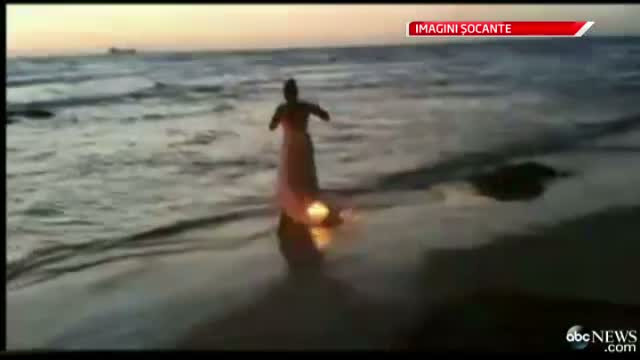 O mireasa dispusa la orice pentru cadrul perfect. Ce i-a permis fotografului sa faca