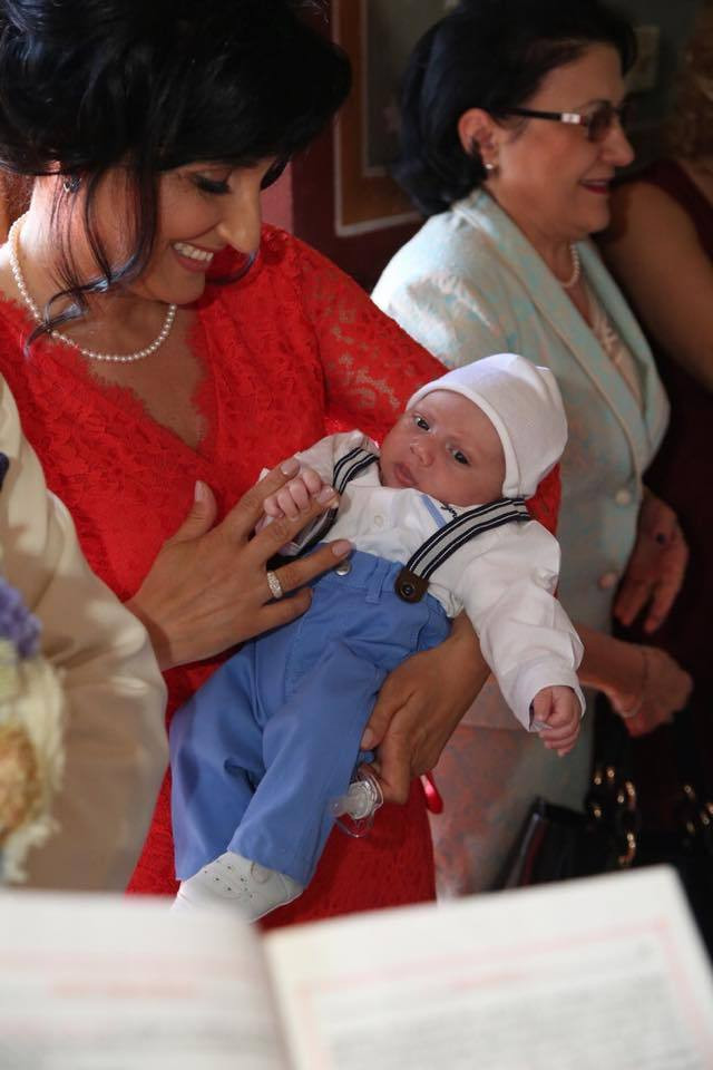 Cum au fost fotografiati Gigi Becali si sotia sa, Luminita, la botezul copilului Gabrielei Firea