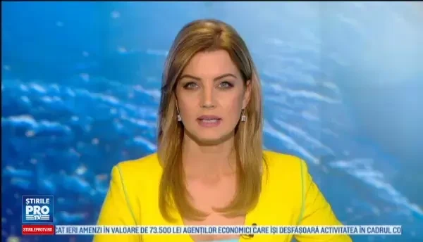 Cum arata tinuta acestei prezentatoare meteo inainte ca un coleg sa o acopere cu sacoul lui: Am dat-o in bara