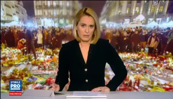 Cladirea Guvernului Romaniei, iluminata in culorile drapelului belgian. Gestul facut de Ciolos dupa un moment de reculegere