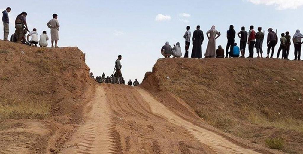 Un refugiat sirian ajuns in Germania s-a fotografiat cu capete umane trase in teapa si a postat imaginile pe Facebook