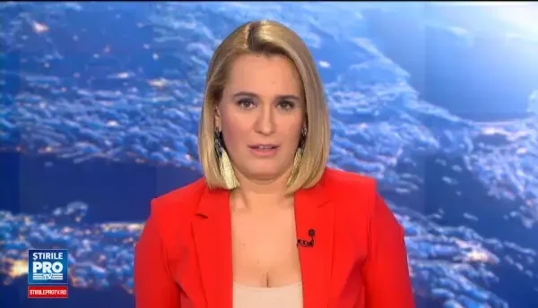 Un copil s-a lasat convins cu greu sa ii ofere Reginei Elisabeta un buchet de flori. Baiatul a incercat sa fuga