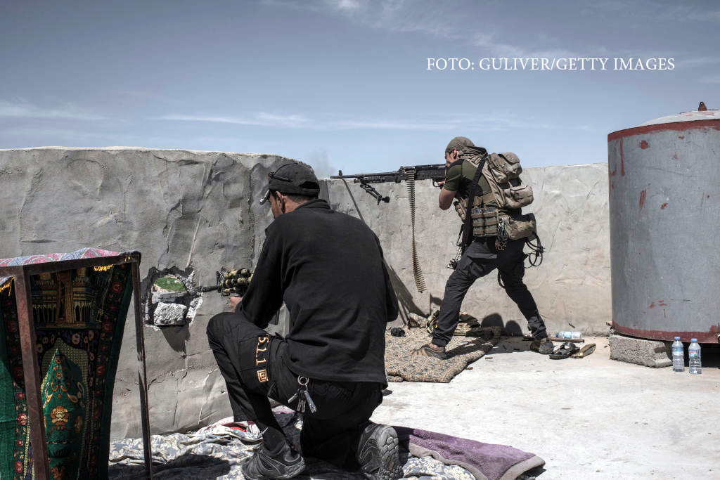 Iraqi Counter Terrorism Service (ICTS) soldiers fire at Islamic State fighters in Al Yarmuk, west Mosul