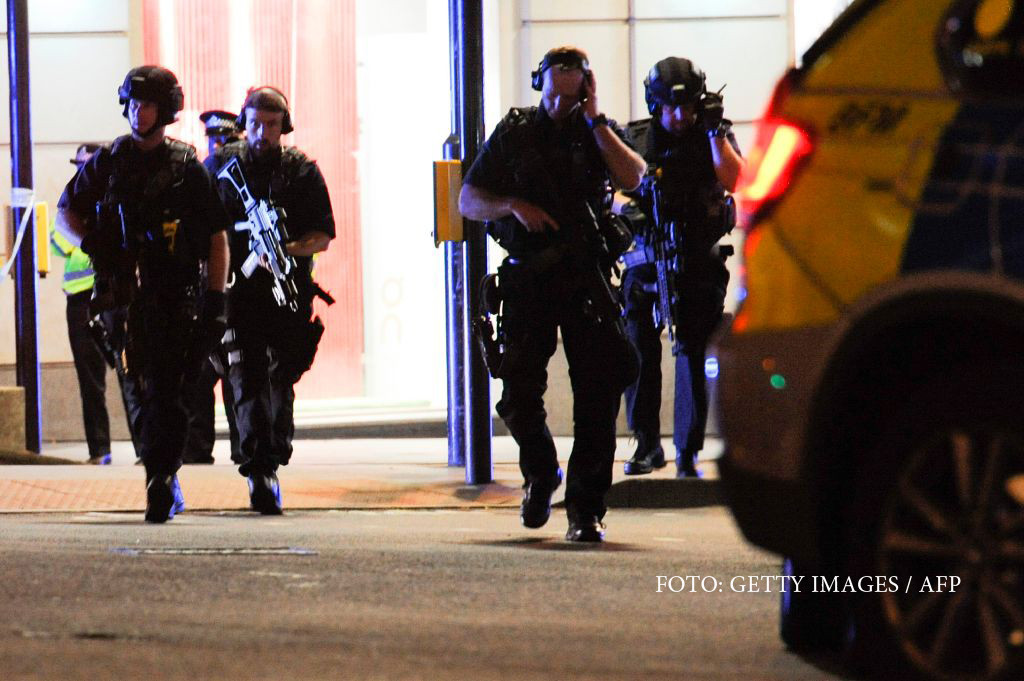 Armed police take position at the scene of a terror attack on London Bridge in central London