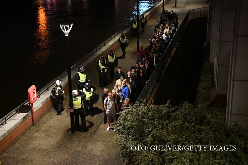 People are lead to safety away from London Bridge after an attack on June 4, 2017 in London, England