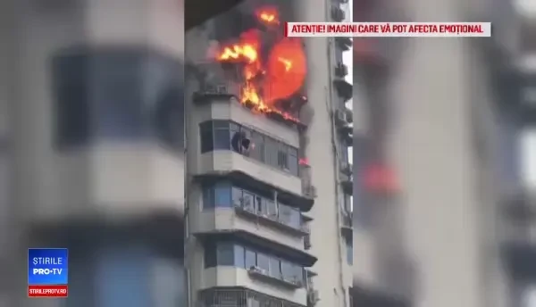 Salvare dramatică pentru un chinez prins de incendiu la etajul 24, într-un bloc cu gratii la geamuri