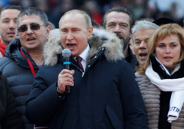 Vladimir Putin acuzat că a obligat ruși să participe la mitingul de pe stadionul Luzhniki