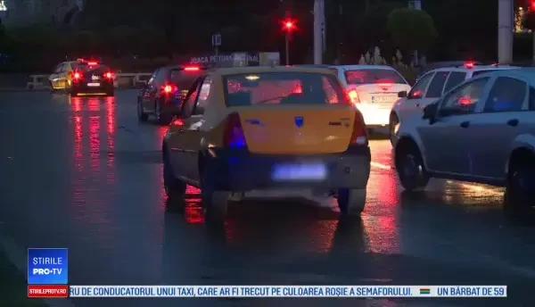 Poliţistă luată pe capotă de un taximetrist, în Capitală. Şoferul dă vina pe ea