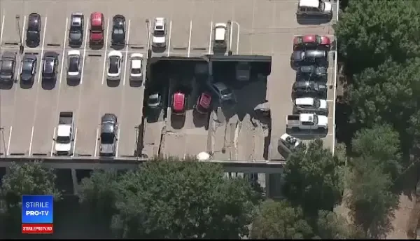 21 de mașini avariate, după ce o parcare supraetajată s-a prăbușit