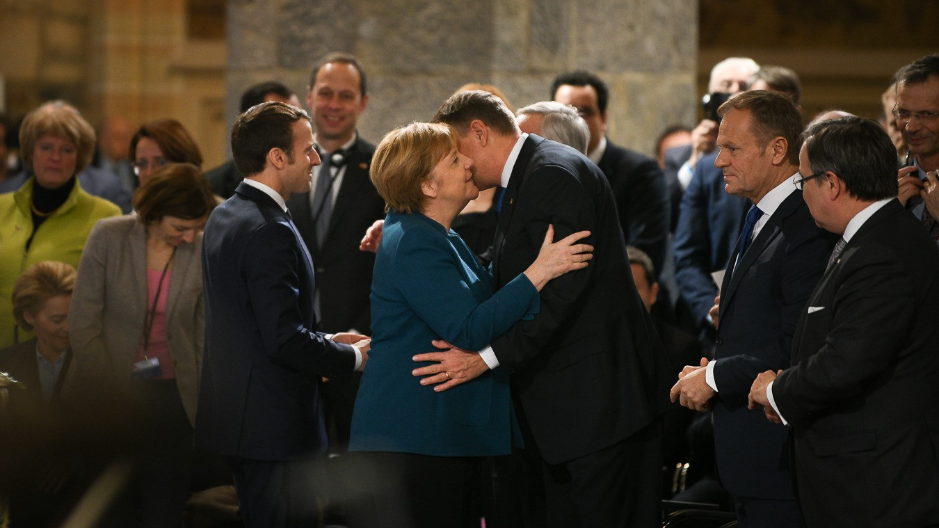 Iohannis, în Germania. Ceremonie importantă cu Emmanuel Macron și Angela Merkel