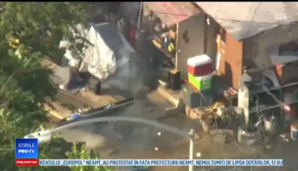 Scene de haos. Atacator împușcat de polițiști după ce a ieșit pe fereastră cu mitraliera