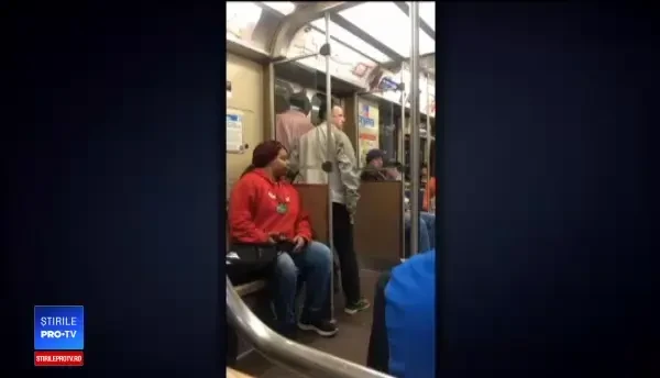 Momentul în care un călător din metrou a imobilizat un bărbat înarmat cu un pistol