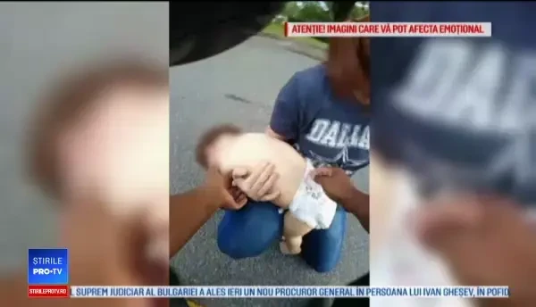 Un polițist a salvat de la moarte un bebeluș înecat cu un biscuit. VIDEO