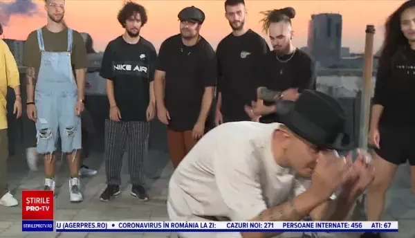 Imagini spectaculoase surprinse în București. Cei mai buni dansatori din țară au făcut spectacol pe terasa unui bloc