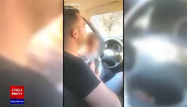 VIDEO șocant. Un bărbat conduce mașina ținând un bebeluș pe volan și ascultând manele