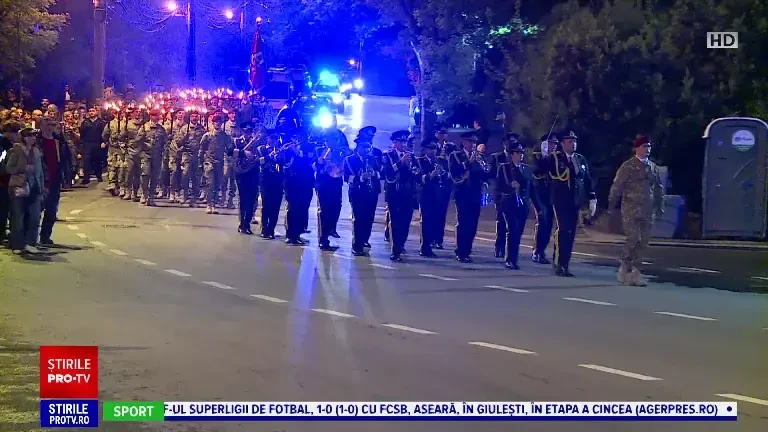 Forțele Terestre au defilat cu torțe în centrul Bucureștiului. ”Suntem în siguranță cu ei”