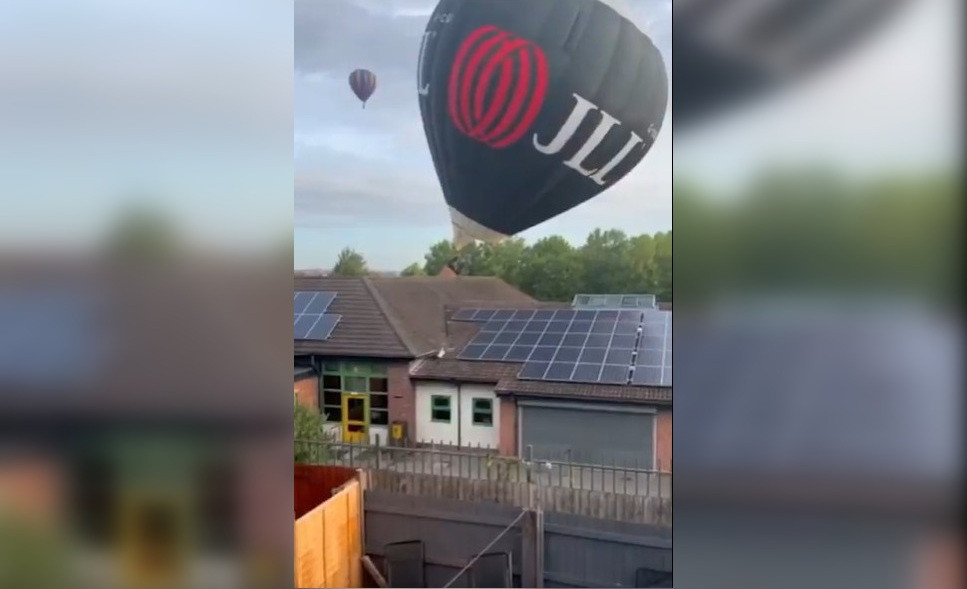 Momentul în care un balon cu aer cald era cât pe ce să se răstoarne, după ce s-a izbit de acoperișul unei școli. VIDEO